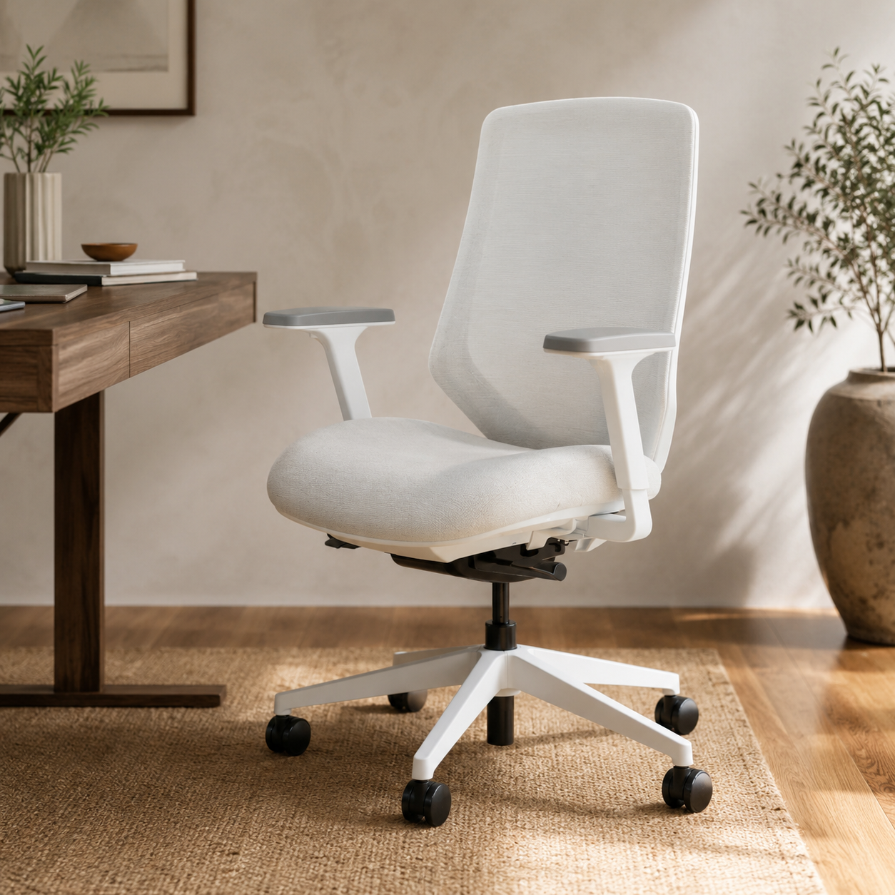 Branch Ergonomic Pro Chair in warm upholstery with adjustable lumbar support and a five-star wheeled base
