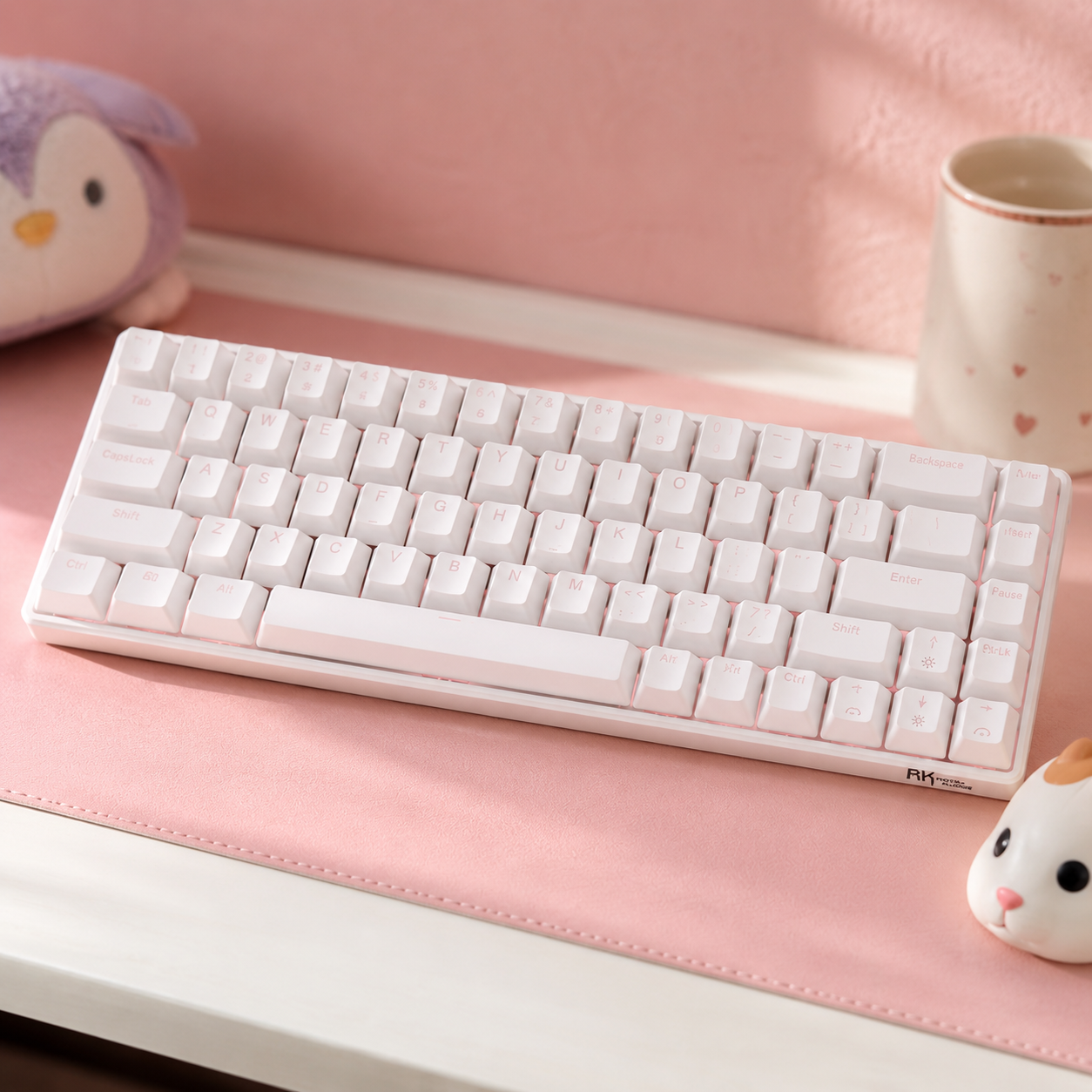 RK Royal Kludge RK68 65 percent mechanical keyboard in pastel pink colorway with cream keycaps on a pastel desk mat