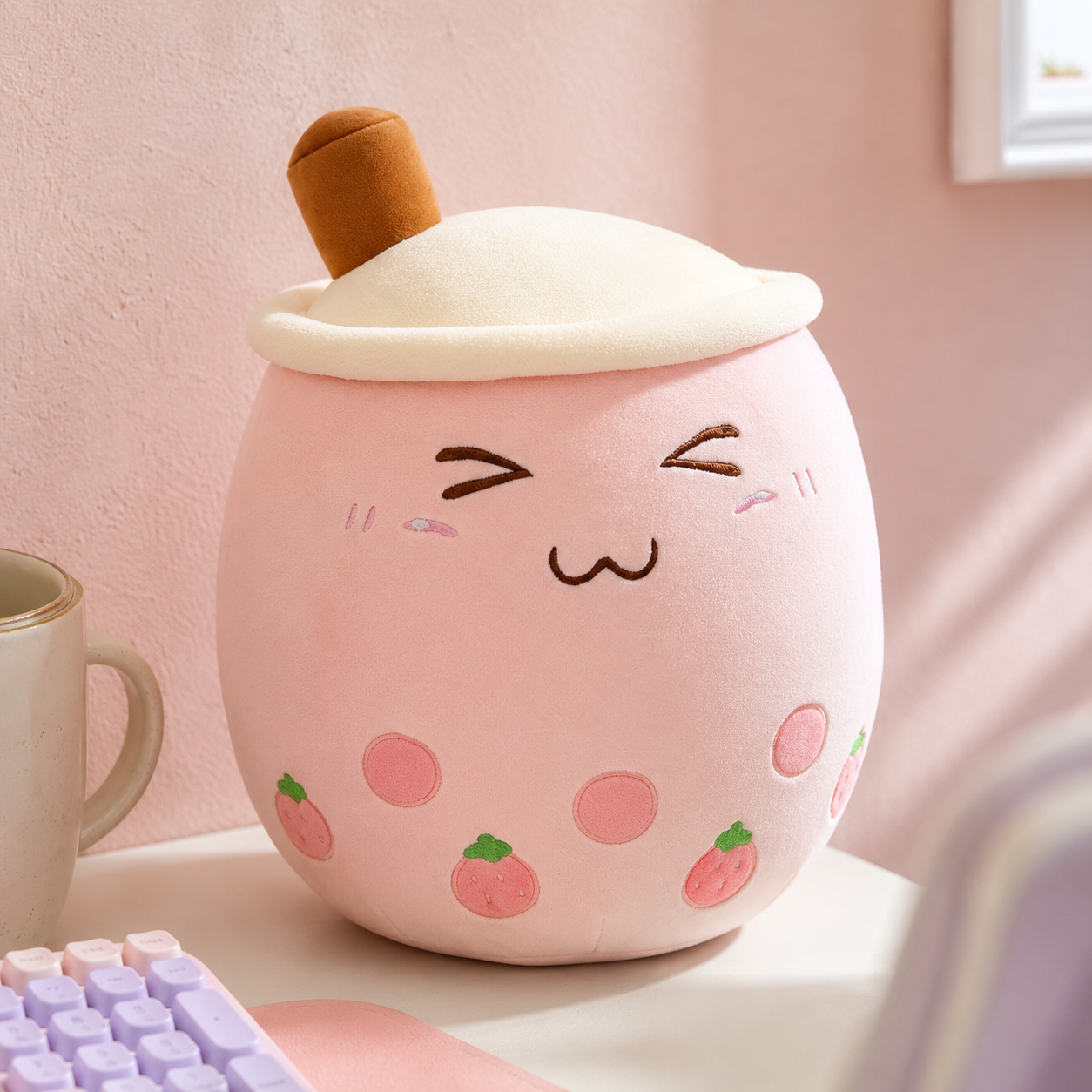 Soft 12-inch stuffed bubble plushie in pastel colorway sitting at the corner of a kawaii desk