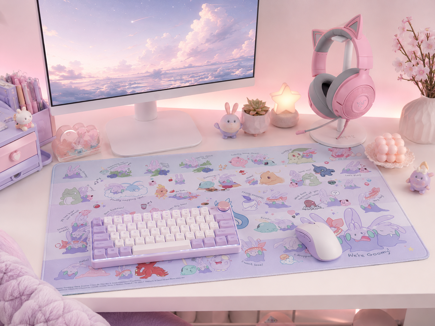 A cohesive pastel gaming desk with a large pastel desk mat tying every element into one soft coordinated palette