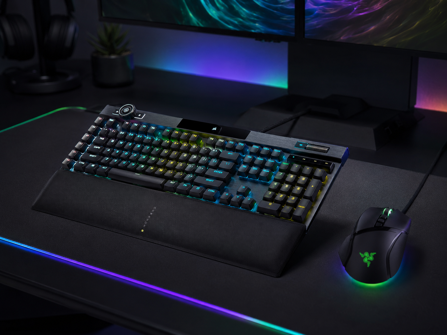 A premium mechanical gaming keyboard and high-performance mouse with coordinated per-key RGB on a large desk mat