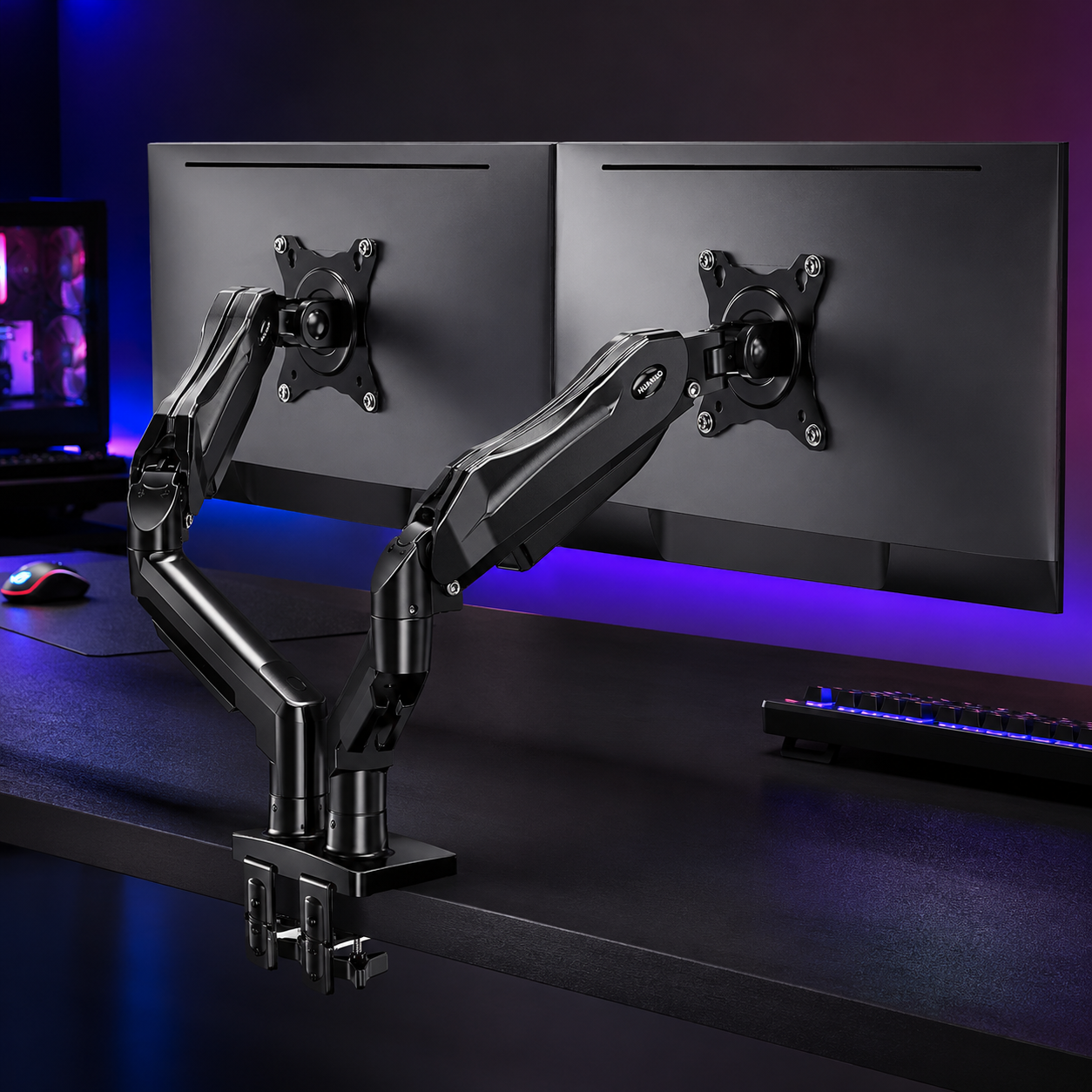 HUANUO FlowLift dual monitor stand holding two screens above a clear desk