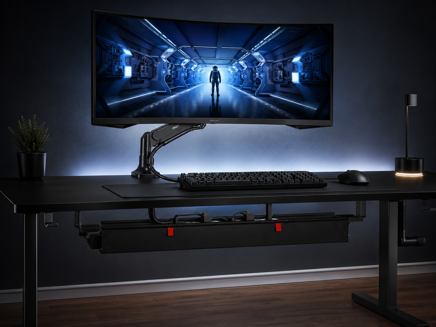 Clean cable routing on an ultrawide setup with few cables bundled and hidden under the desk